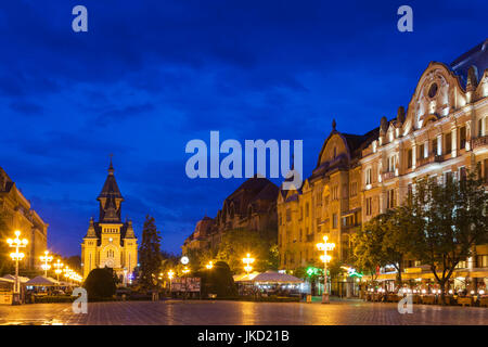 Romania, Banat Region, Timisoara, Piata Victoriei Square and Metropolitan Cathedral, evening Stock Photo