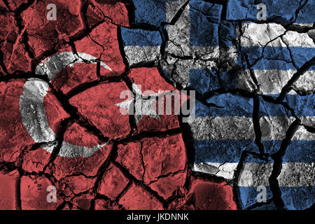 Turkey and Greece flag on cracked ground . Confliction and crisis concept . Stock Photo