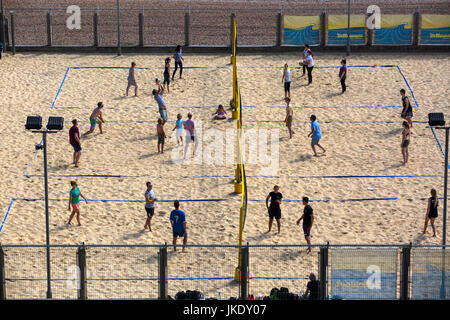 Beach Volleyball being played on the beach in Brighton, England. Stock Photo