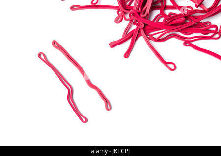 Bunch of red rubber bands isolated on white Stock Photo