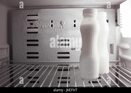Drinking yogurt without label in the fridge. Photo for your design. Stock Photo