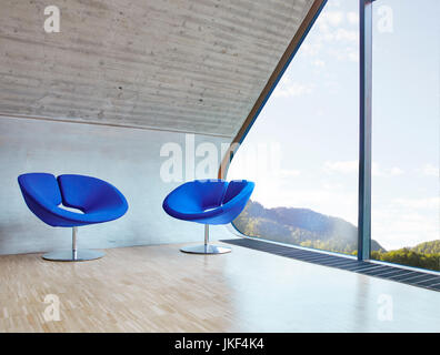 Two chairs in empty attic office Stock Photo