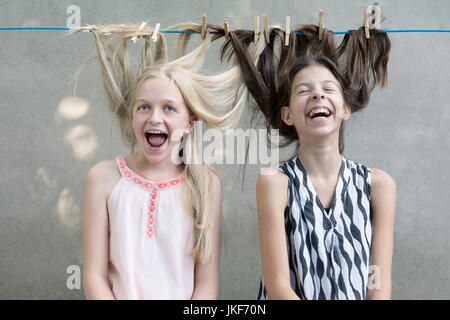 Girls hair drying on clothesline Stock Photo