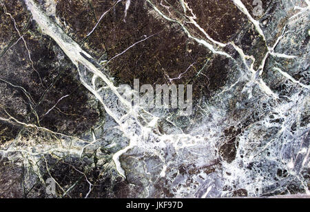 Black stone background with cracks, black marble Stock Photo