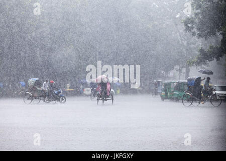 Dhaka, Dhaka, Bangladesh. 23rd July, 2017. July 23, 2017 Dhaka, Bangladesh ''“ Rickshaw puller carrying passenger when heavy rainfall maid in the Dhaka city. Credit: K M Asad/ZUMA Wire/Alamy Live News Stock Photo