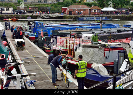 Bristol, UK. 23rd July, 2017. The harbour festival started back in 1971 by a group of boat owners trying to stop Bristol City Council from filling in the harbour, they succeeded. Now still mainly a free festival and having a nautical theme a with a variety of boats in the floating harbour it has evolved and grown. This year rain, sometimes heavy, has interspersed with some sun cutting attendance slightly. Some of the many colourful boats in the harbour during the festival. Credit: Charles Stirling/Alamy Live News Stock Photo