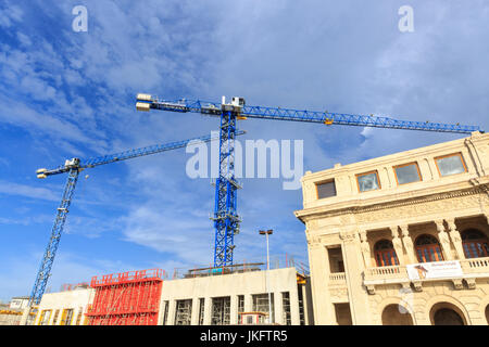 Cranes and building work, construction site in Old Havana, Cuba Stock Photo