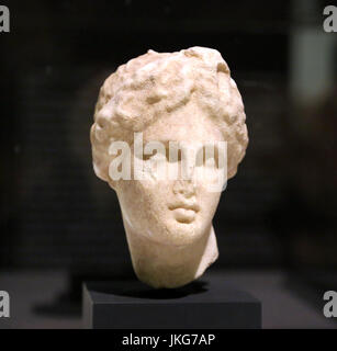 Head of Apollo. Hellenistic copy of The Apollo Lyceus by Praxiteles. 2nd Century AD. Marble of Paros. Emporion-Empuries, Girona, Spain. Stock Photo