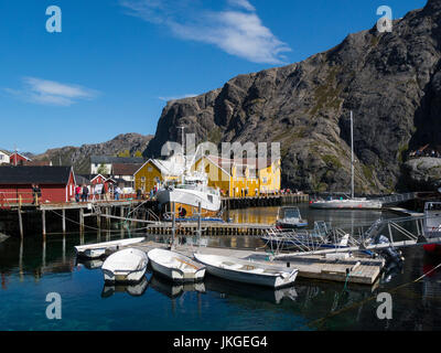 Nusfjord harbour in old preserved fishing village now a museum  Flakstadøy one of main islands of Lofoten archipelago Norway busy with visiting touris Stock Photo