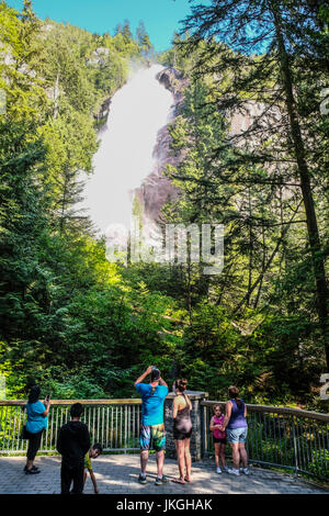 Tourists taking pictures at the Bridal Veil Falls at British Columbia, Canada Stock Photo