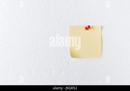 pink paper note with pin on foam sheet, concept remember and memory Stock Photo