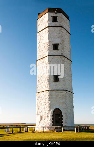 The chalk tower at Flamborough Head was built in 1674 as a lighthouse.  Its main use however was as a visible coastal beacon and a signalling tower. Stock Photo