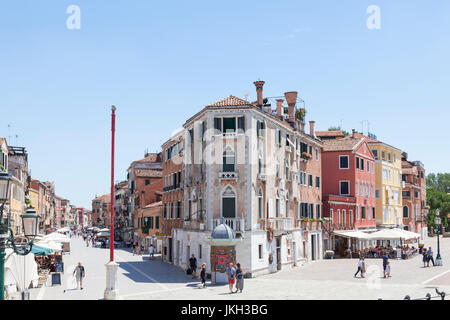 Via Giuseppe Garibaldi, Castello, Venice, Italy with John Cabot House in the centre  and a view along Riva dei Sette Martiri  with its colorful houses Stock Photo
