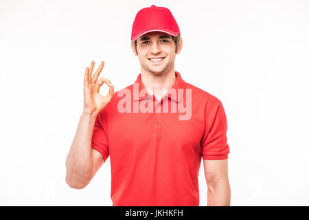 Delivery man making ok sign on white Stock Photo