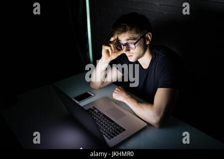angry businessman workaholic working late at home Stock Photo