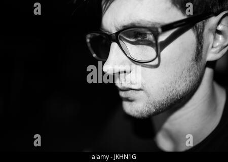 Software developer coding on his laptop at night Stock Photo