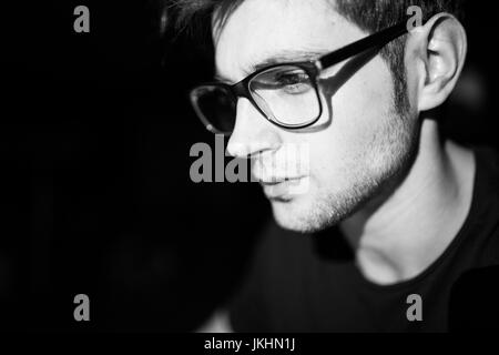Software developer coding on his laptop at night Stock Photo