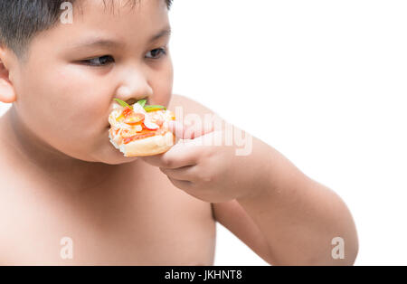 obese fat boy eating seafood pizza, concept junk food can cause obesity. isolated on white background Stock Photo