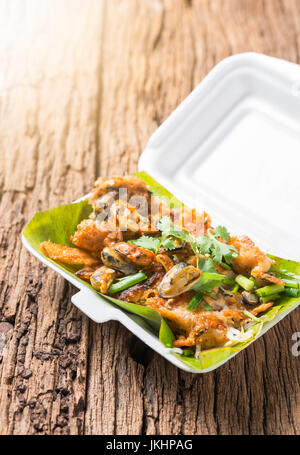 Oysters fried - crispy mussel with bean sprout, Crisp fried oyster pancake in foam box Stock Photo