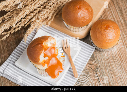 bread with milk tea on wood background Stock Photo