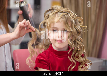 Little girl with curly hair. Stock Photo