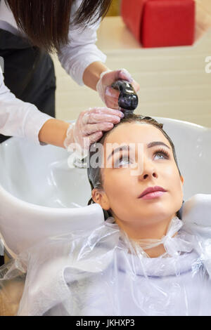 Young woman getting head washed. Stock Photo