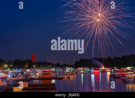 Fireworks of summer holiday in a city. Stock Photo