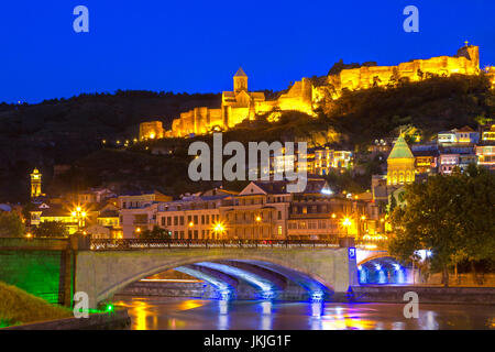 Night view over the Metekhi Bridge and Narikala Castle, in Tbilisi, Georgia. Stock Photo