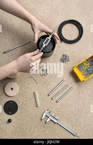 Guy using wrench in workshop Stock Photo