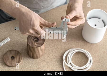 Man using caliper in workshop Stock Photo