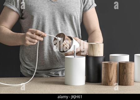 Assembling of lamp in workshop Stock Photo