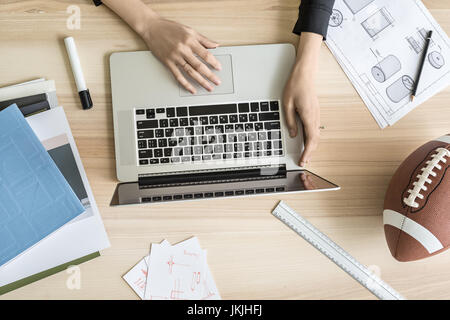 Woman using laptop in office Stock Photo