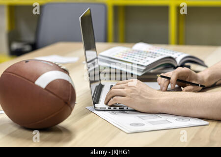 Man using laptop in office Stock Photo