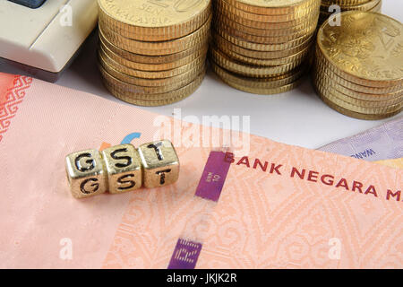 GST wording and gold coins. Stock Photo