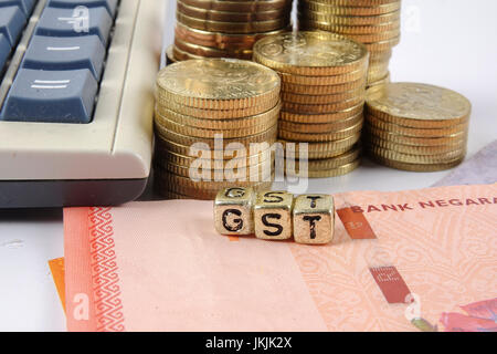 GST wording and gold coins. Stock Photo