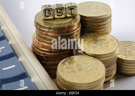 GST wording and gold coins. Stock Photo