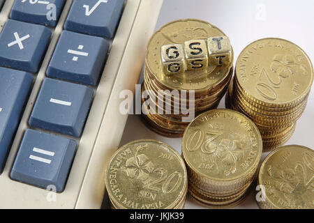 GST wording and gold coins. Stock Photo