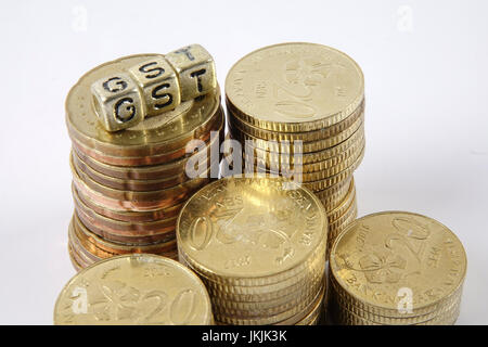 GST wording and gold coins. Stock Photo