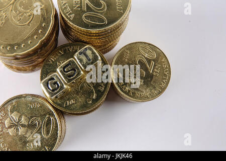 GST wording and gold coins. Stock Photo