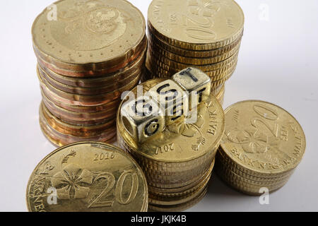 GST wording and gold coins. Stock Photo