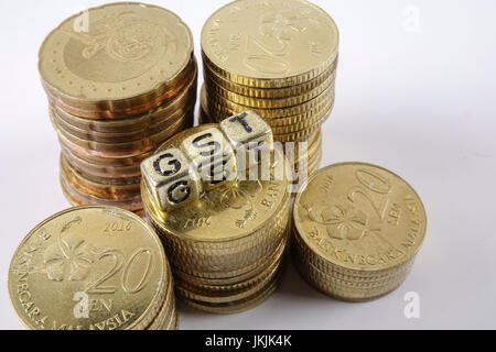 GST wording and gold coins. Stock Photo