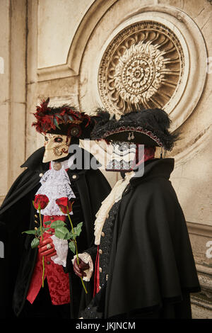 male and female Baute Mask wearers in the Carnival of Venice, Italy Stock Photo