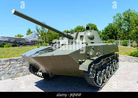 Military equipment. Old tank. A monument in the park. Stock Photo
