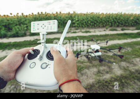 Remote control in the hands of the person. Stock Photo