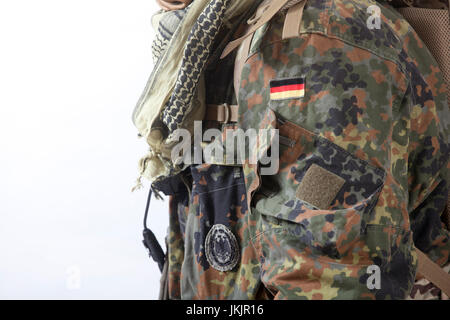 Army soldier in camouflage uniform against white background, isolated Stock Photo