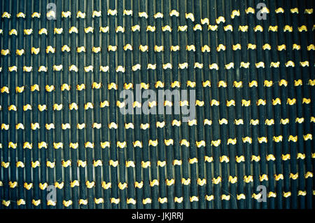 Black gray fishnet cloth material texture background. Black texture and yellow background with copy space for text or image. Stock Photo