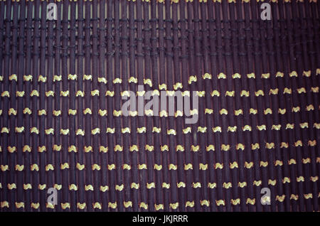 Black gray fishnet cloth material texture background. Black texture and yellow background with copy space for text or image. Stock Photo