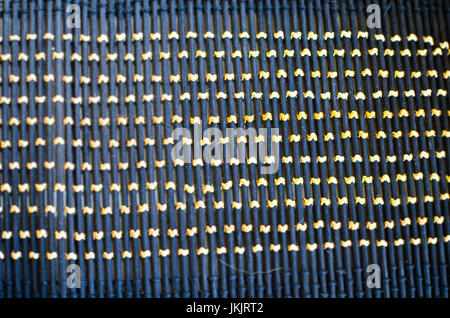 Black gray fishnet cloth material texture background. Black texture and yellow background with copy space for text or image. Stock Photo