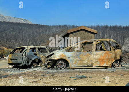 Kucine, Split, Croatia - July 18, 2017: Burned cars after massive wildfire burning down the forest and villages around city Split Stock Photo