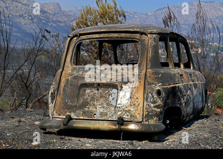 Koresnica, Split, Croatia - July 18, 2017: Burned car after massive wildfire burning down the forest and villages around city Split Stock Photo